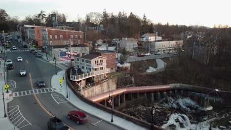 The-Wappinger-Creek-falls-and-downtown-Wappingers-Falls-is-shown-from-the-bridge-in-this-4K-aerial-footage