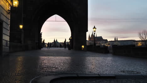 Silhouette-of-Arch-Gate-to-Chrles-Bridge,-Prague-Czech-Republic