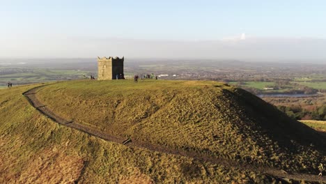 Landmark-hillside-Rivington-tower-Lancashire-reservoir-countryside-aerial-pull-away-view