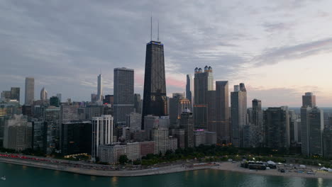 Near-North-Side-skyline-on-a-cloudy-evening,-in-Chicago---pull-back,-aerial-view