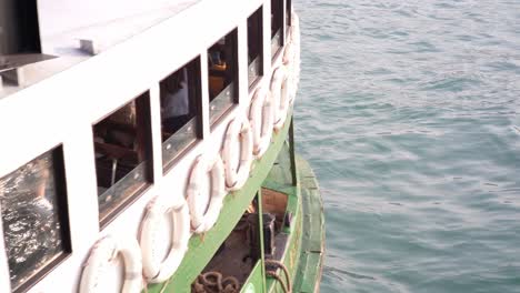 Close-up-of-passengers-traveling-on-water-on-Star-Ferry-in-Hong-Kong