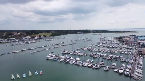 Wide-drone-shot-of-a-boat-filled-river-on-an-overcast-bright-day-on-the-river-Hamble