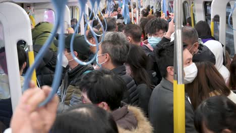 Chinese-commuters-ride-on-a-crowded-MTR-subway-train-line-during-the-Chinese-Lunar-New-Year-in-Hong-Kong