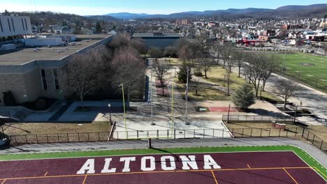 Altoona-High-School-football-field-revealing-sprawling-American-town-in-Pennsylvania