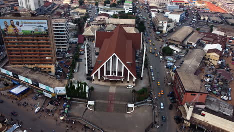 Aerial-view-towards-the-Cathedral-of-Our-Lady-of-Victories-in-Yaounde,-Cameroon