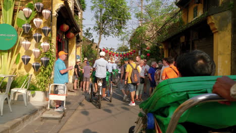 A-point-of-view-shot-of-a-tourist-passenger-riding-on-a-local-cyclo-transportation-to-roam-around-the-City-of-Hoi-An-in-Vietnam