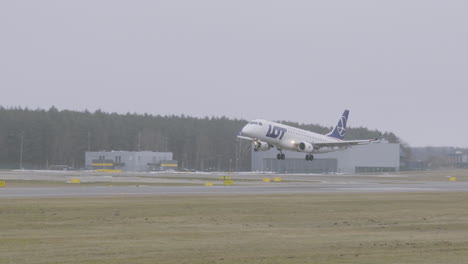LOT-Polish-Airlines-Commercial-Jet-Airplane-Landing-on-Runway-at-Airport-Lecha-Wałesy-in-Gdansk---Tracking-slow-motion