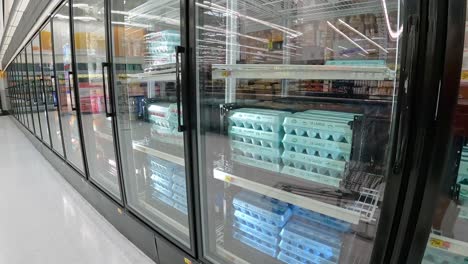 Slowly-passing-dozens-of-eggs-in-the-refrigerated-displays-in-an-American-mega-grocery-store