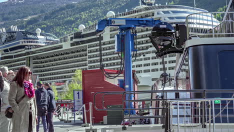 Boarding-on-and-off-a-cruise-ship-at-the-terminal-in-Flam,-Norway---time-lapse