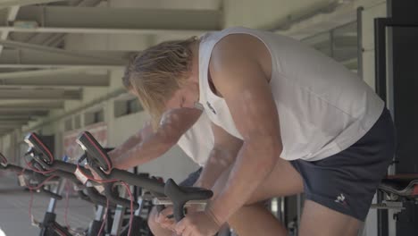 Rugby-Players-Training-on-Stationary-Bikes-in-Slow-Motion-Before-a-Match