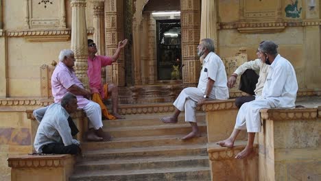 Elderly-friends-talking-and-chilling-outside-lord-shiva-temple