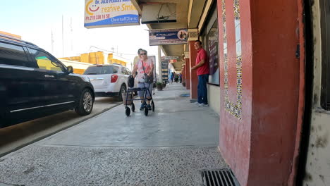 View-of-activity-on-a-street-in-Mexican-border-town-near-a-dentist-and-pharmacy
