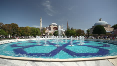 Fountain-in-Front-of-Hagia-Sophia-Mosque,-Landmark-of-Istanbul-Turkey-on-Sunny-Summer-Day