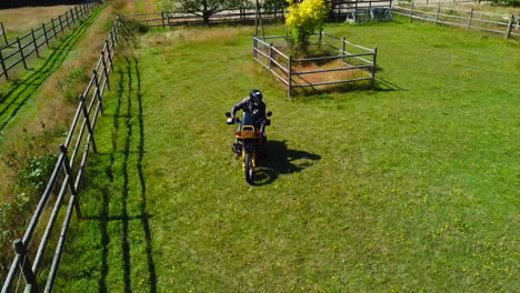 Older-Man-on-Motorcycle-on-Green-Field-on-a-Canadian-Farm