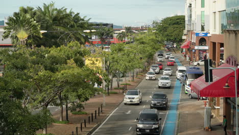 Kota-Kinabalu-City-Life---cars-slowly-moving-in-traffic-on-small-road---high-angle-view