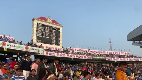 KOLKATA,-INDIA--Low-angle-shot-of-crowded-Eden-Gardens-stadium-during-India-vs-Sri-Lanka-cricket-match-in-Kolkata,-West-Bengal,-India-during-evening-time