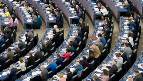 Members-of-the-European-Parliament-voting-during-the-EU-plenary-session-in-Strasbourg,-France---Panning-shot