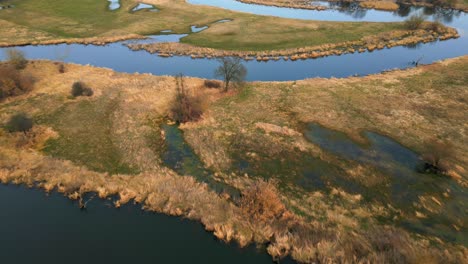 Aerial-shot-of-flooded-fields-and-natural-meander