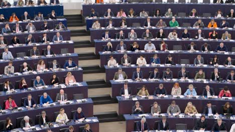 Members-of-the-European-Parliament-voting-during-the-EU-plenary-session-in-Strasbourg,-France---Panning-shot