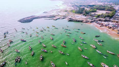 traditional-flouting-fisher-boat-in-the-Indian-Ocean,-aerial-view-of-drone-camera,-aerial-drone-scene,-blue-flag-beach-in-India