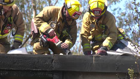 Firefighters-cut-into-roof-of-burning-building