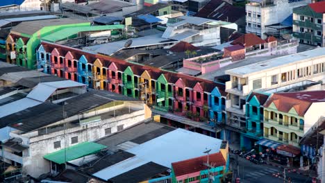 Side-by-Side-multicolor-community-shop-houses-and-homes-in-Betong-town,-Thailand