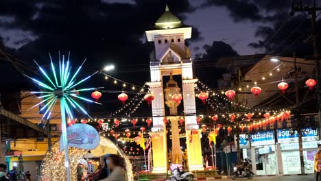 Night-city-lights-with-Chinese-lanterns-and-people-walking-during-Betong-Festival-in-Thailand