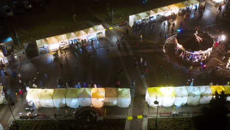 Drone-view-of-Christmas-stalls-and-carousel-on-the-Podgorski-Square-with-St
