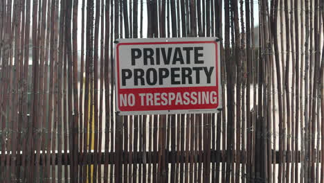 Private-property-sign-on-a-wooden-fence