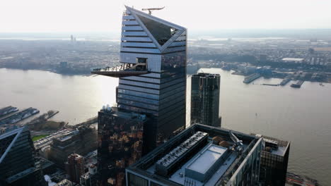 Aerial-view-around-the-30-Hudson-Yards-skyscraper,-golden-hour-in-New-York,-USA