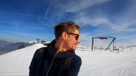 Happy-man-enjoying-the-snowy-environment-on-skis