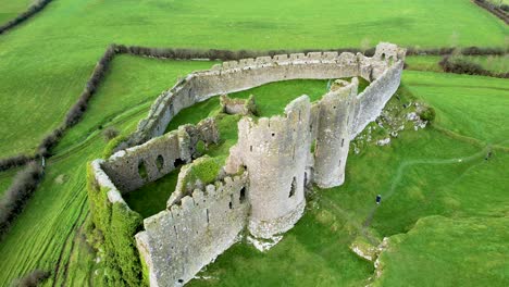 An-aerial-4K-rising-shot-of-the-spectacular-Norman-Castle-Roche-remains-high-on-a-Rocky-outcrop-in-Co-Louth-Nr-Dundalk-Ireland-Looking-West