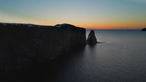Cinematic-drone-shot-of-famous-Perce-rock-in-Quebec,-Canada
