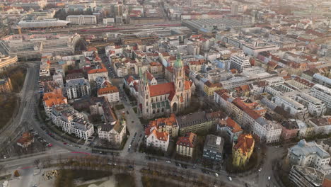 Aerial-5K-Drone-Flyover-St-Paul's-Cathedral-Square-And-Downtown-Buildings-In-Munich,-Germany
