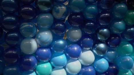 Panning-view-of-the-background-of-multicoloured-stacked-balloons