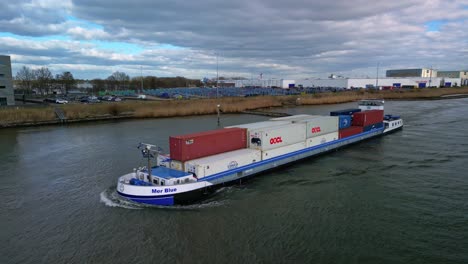 The-containership-Mer-Blue-navigating-through-the-canals-of-Zwijndrecht,-The-Netherlands
