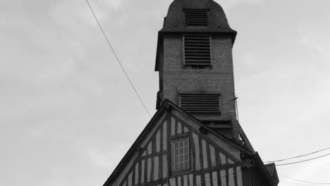 Bell-Tower-Of-The-Church-Of-Saint-Catherine-In-Honfleur,-France---tilt-down