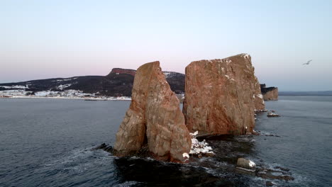 Cinematic-drone-shot-of-famous-Perce-rock-in-Quebec,-Canada