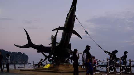 Swordfish-statue-in-Ao-Nang-beach,-Krabi-Thailand-with-people
