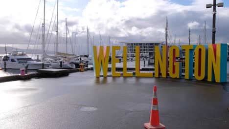 Runners-and-walkers-passing-the-Wellington-sign-during-Gazley-Volkswagen-Wellington-Marathon-2022,-New-Zealand-Aotearoa
