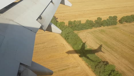 Jet-airplane-landing-shadow-on-the-ground