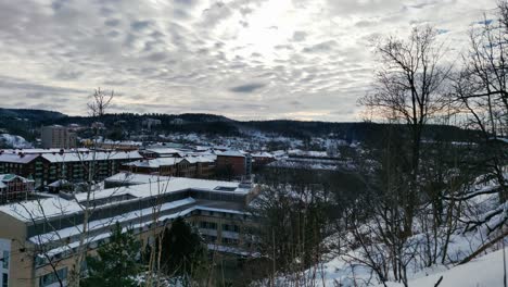 High-Angle-Pan-Over-Scandinavian-Town-Covered-In-Snow