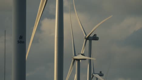 Wind-turbines-with-rotating-rotor-blades-at-a-test-center-for-wind-turbines