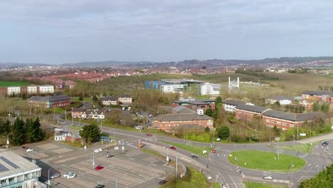 Aerial-rising-up-to-the-view-of-the-city-of-Exeter,-Devon