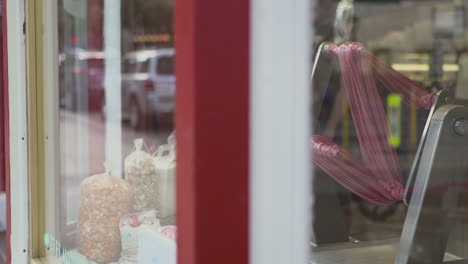 Taffy-being-made-in-storefront-window