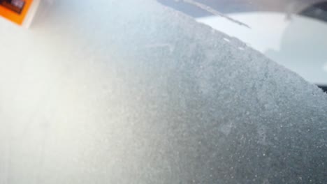 Scraping-ice-off-a-car-window