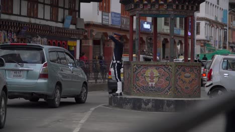 The-only-traffic-square-of-Thimphu-in-Bhutan,-had-a-great-display-of-traffic-control-by-the-traffic-police-stationed-on-the-circle