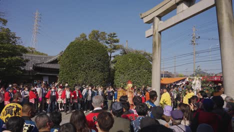 Crowd-Stands-at-Giant-Torii-Gate-to-Tagata-Shrine-for-Honensai