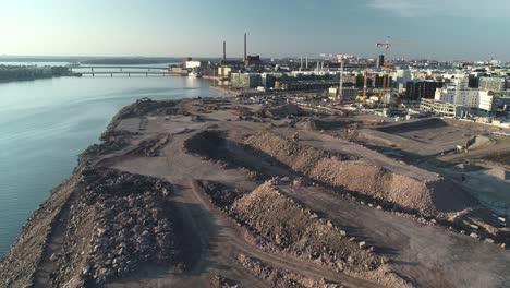 Aerial-shot-tracking-forward-of-a-construction-site-in-Helsinki,-Finland