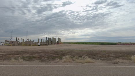 Fracking-platform-displaces-rows-of-corn-in-this-drive-by-shot-of-fields